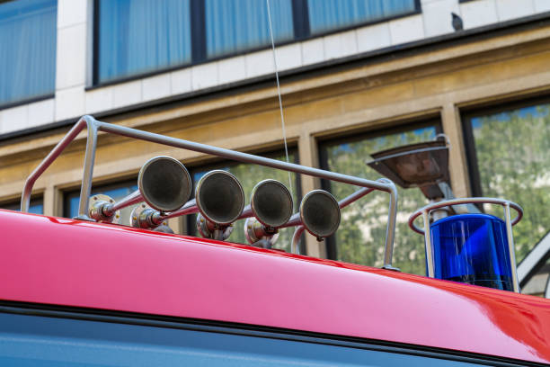 flashing blue signal and four vintage signal horns on the fire truck. - brass instrument flash imagens e fotografias de stock
