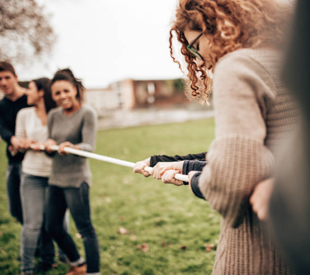 istock doing the tug of war all together 1498250022