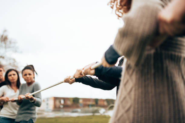 istock doing the tug of war all together 1498250821