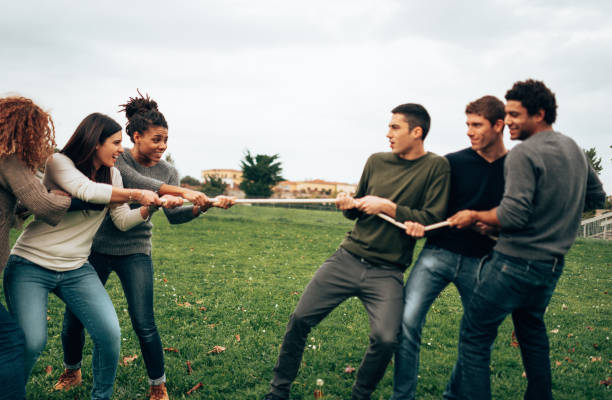 istock doing the tug of war men vs women 1498250885