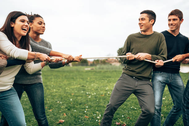 istock doing the tug of war men vs women 1498250923