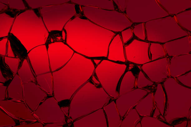 istock cracked glass. broken glass background or texture 1498251317