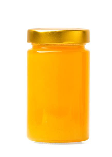 istock Fresh honey in a jar on a white isolated background. 1498251351