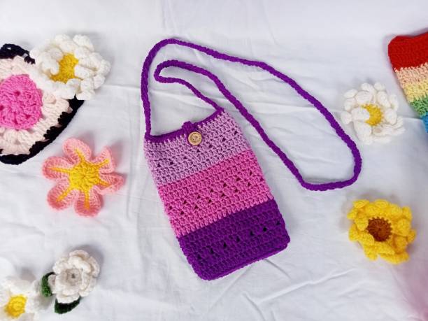 istock Crochet phone bag pattern tone purple background texture 1498255538