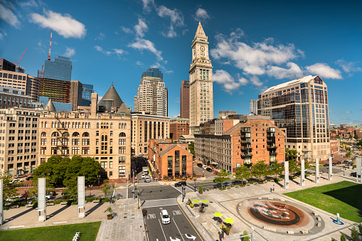 Downtown city skyline view of the office buildings and apartments from the harbour wharf in the North End of downtown Boston Massachusetts United States