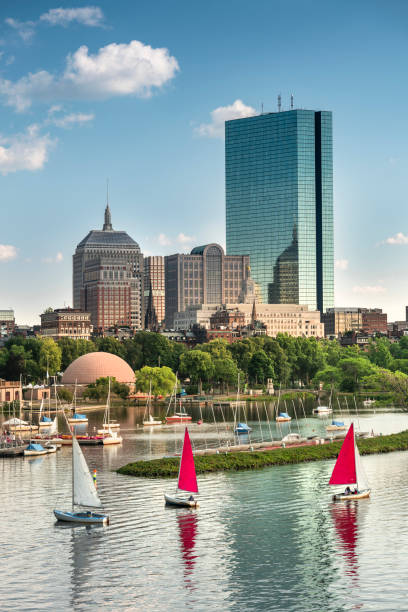 Boston Massachusetts USA downtown city skyline and boat marina on the Charles River Boston Massachusetts USA downtown city skyline of the office buildings, apartments and sailing Marina along the Esplanade real estate outdoors vertical usa stock pictures, royalty-free photos & images