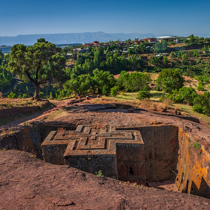 Church of Saint George is the most well known and last built of the eleven rock-hewn churches in the Lalibela area. Bete Giyorgis is carved from solid red volcanic rock in the 12th century, Lalibela. Ethiopia, Africa.