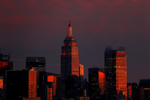 Manhattan skyline at dusk view from New Jersey after sunset light reflecting off the buildings.