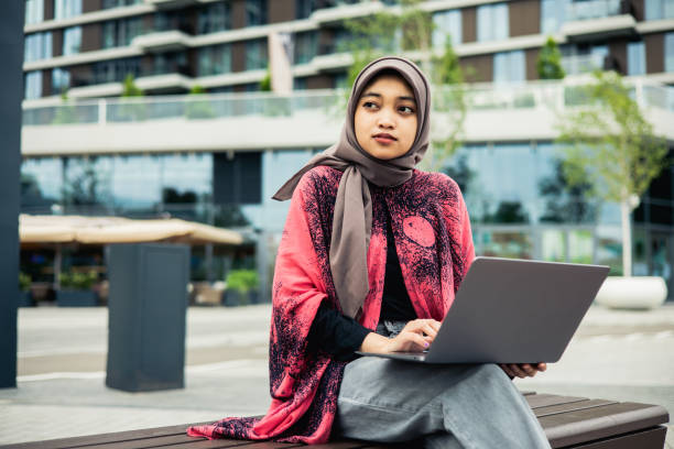 istock Young businesswoman working on her laptop 1498259625