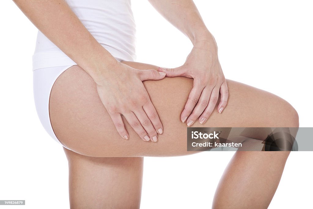 Female person checks her skin on cellulite Female person checks her skin on cellulite. All on white background. Adult Stock Photo