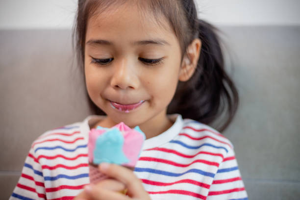Cute Toddler Girl Eating Ice-Cream