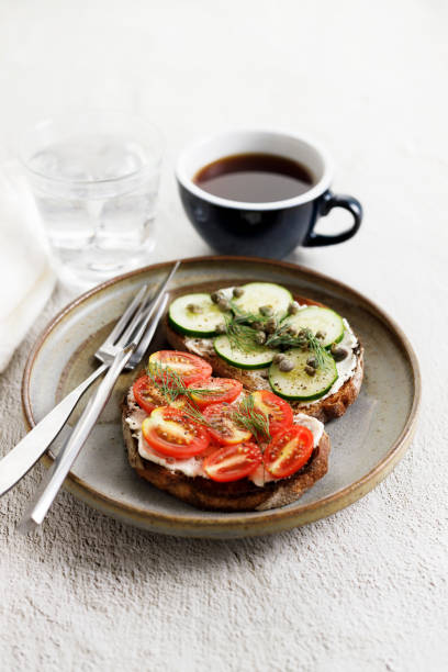 istock Healthy cucumber and tomato toast. 1498289606