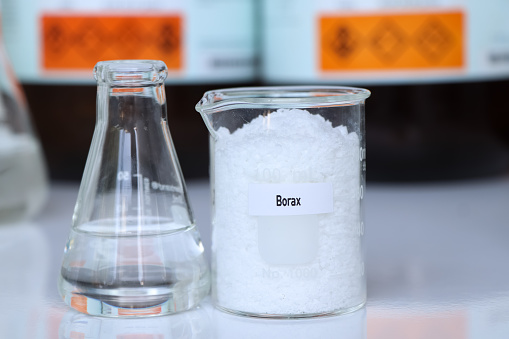 Borax in container, chemical analysis in laboratory, chemical raw materials in industry