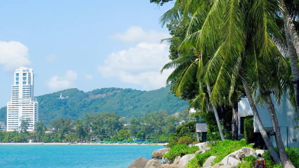istock Beautiful tropical beach with blue sky and modern building on background 1498290757