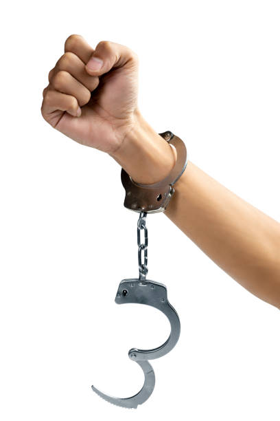 istock Arrested man with a handcuff on his hand 1498294098