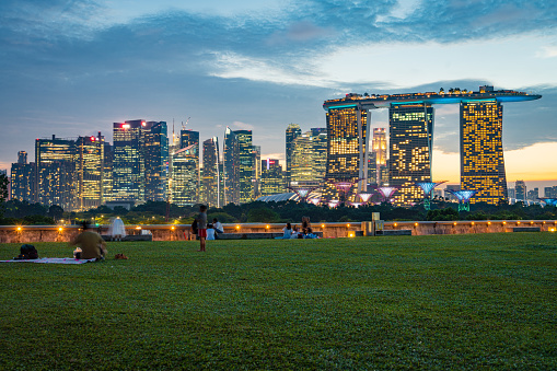 Singapore city  with tourists , City skyline at sunset.