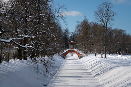 Cross bridge (Krestovy bridge) in the Alexander Park of Tsarskoye Selo on a sunny winter day, Pushkin, St. Petersburg, Russia