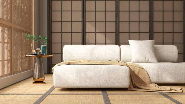 istock Modern cream white fabric bolster back corner sofa, side table, cushion in sunlight, Japanese wooden shoji window, wall, tatami mat 1498298279