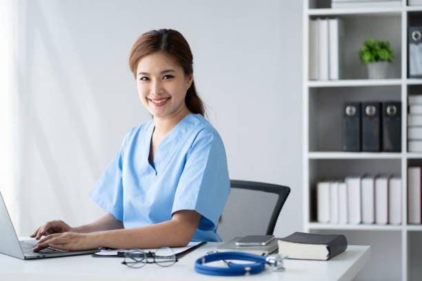 istock Young expert female doctor working in her office room with laptop computer. 1498302157