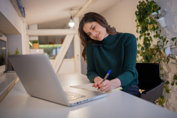 istock Young woman working from home 1498302178