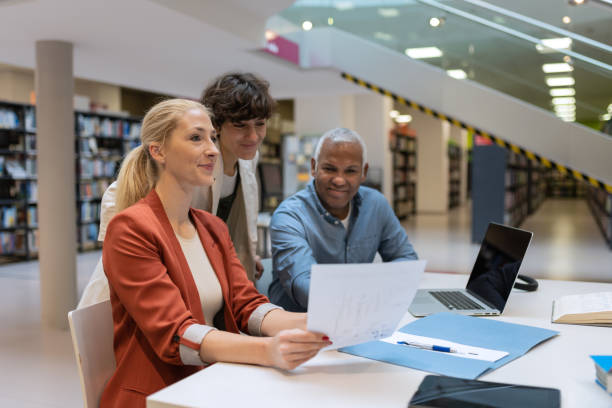 istock Readers and students in the library 1498302331