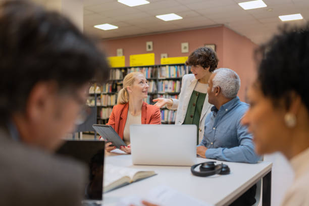 istock Readers and students in the library 1498302338