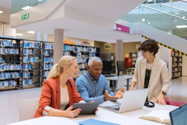 istock Readers and students in the library 1498302343