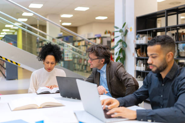istock Readers and students in the library 1498302345