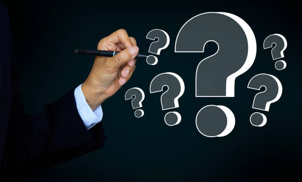 istock Businessman hands show pen writing question marks, Confused, Thinking, brainstorming or decision making concept, problem solving, finding answers 1498307464