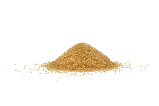 istock Brown sugar powder isolated on white background. Macro shot brown sugar texture isolated 1498313151