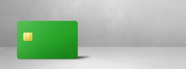 istock Green credit card on a white concrete background 1498315185