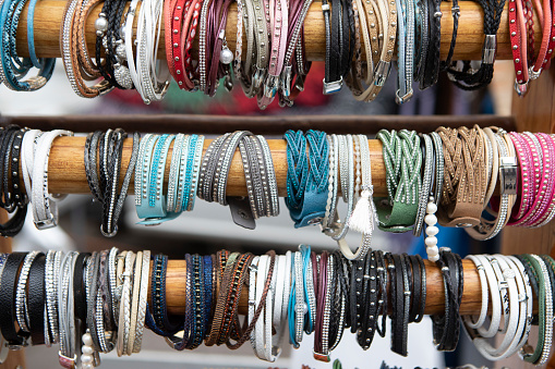 Bracelets on poles on a market stall in Kehl, Germany