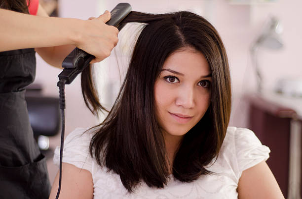 istock Cute young woman getting her hair done 149831597