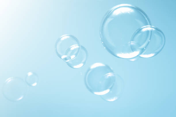 istock Beautiful Transparent Soap Bubbles Floating in The Air. Abstract Background. Freshness Soap Suds Bubbles Water. 1498317050