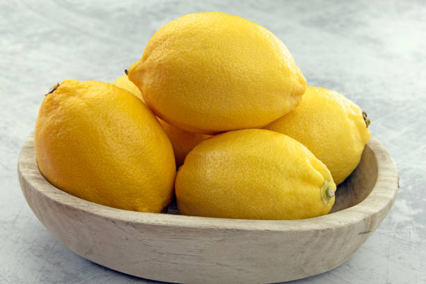 Lemons in a wooden bowl