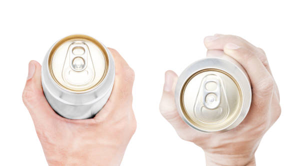 istock Top view hand hold mockup shiny aluminum can isolated on white background with clipping path 1498320957