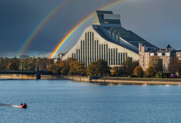 Double rainbow above Daugava river in center of Riga - the capital and largest city of Latvia, a major commercial, cultural, historical and financial center of the Baltic region