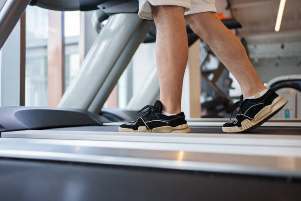 istock Feet on a treadmill, close-up 1498330171