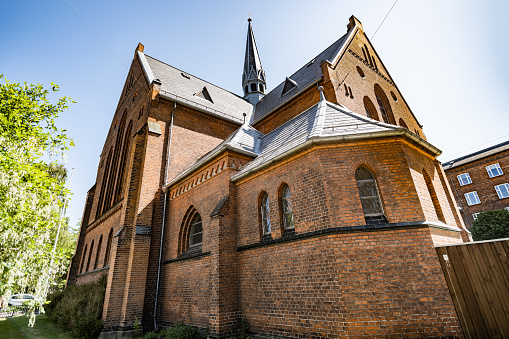 Frederiksberg, Denmark - June 13, 2023: Saint Thomas Church in Frederiksberg was opened in 1898. It was designed by the Danish architect Carl Lendorf.