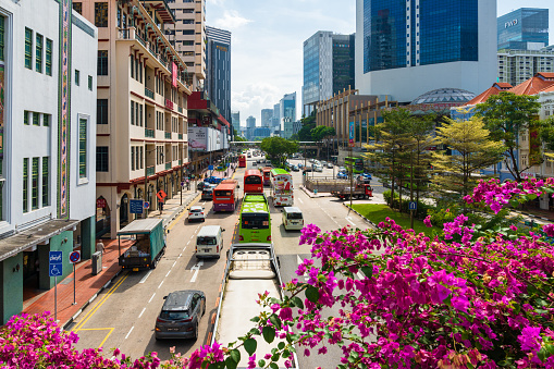 Singapore city road with crowd of transportation on road, concept of busy city street.