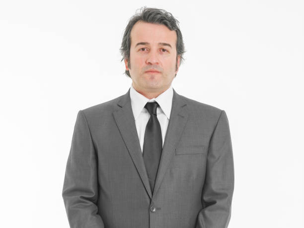 Portrait of businessman. Young businessman in suit posing seriously.