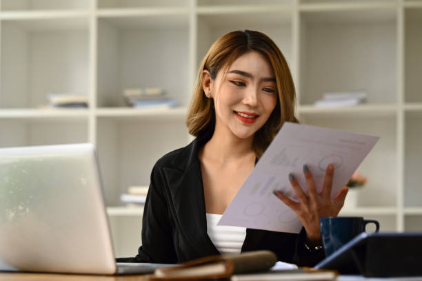 istock Accountant woman using laptop, working with financial graph chart report, preparing present at workplace. 1498337006