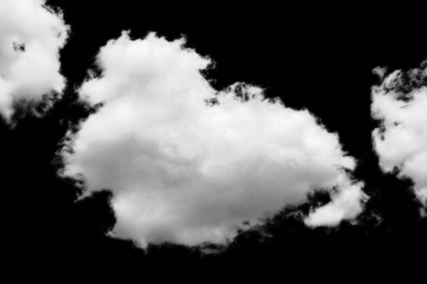 istock white fluffy clouds standing out against a black background and a blue sky 1498337019