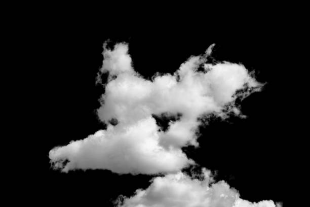 istock white fluffy clouds standing out against a black background and a blue sky 1498337058
