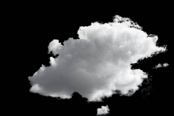 istock white fluffy clouds standing out against a black background and a blue sky 1498338217