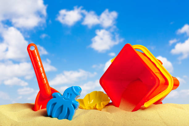 Plastic children toys on the sand beach