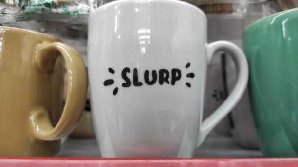 istock White ceramic mug with 'slurp' printing  on it 1498343836