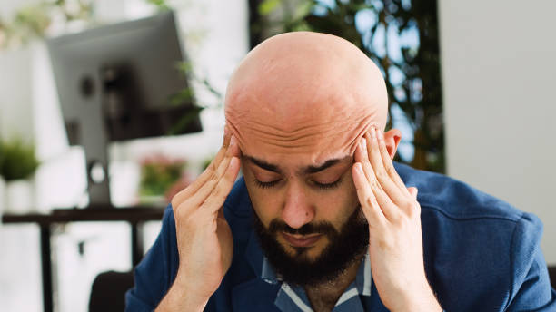 istock Sick businessman suffering from migraine 1498343947