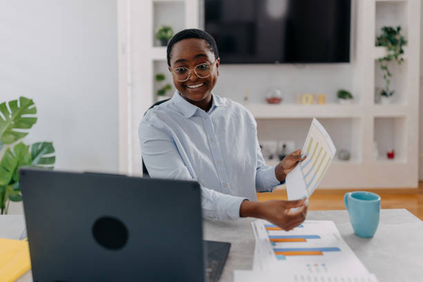 istock Cheerful woman showing a graph in a video call 1498350228