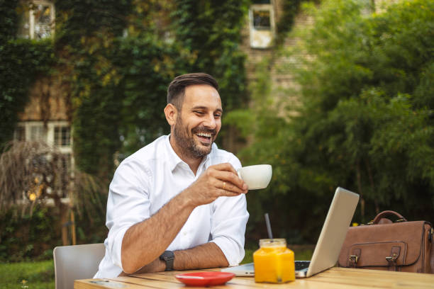 istock Happy Businessman Enjoys Morning Coffee 1498355610